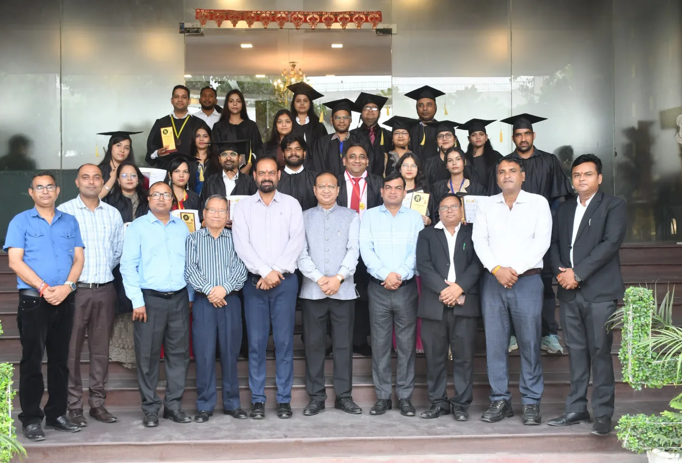 Graduates and faculty at the HLM Law College convocation ceremony